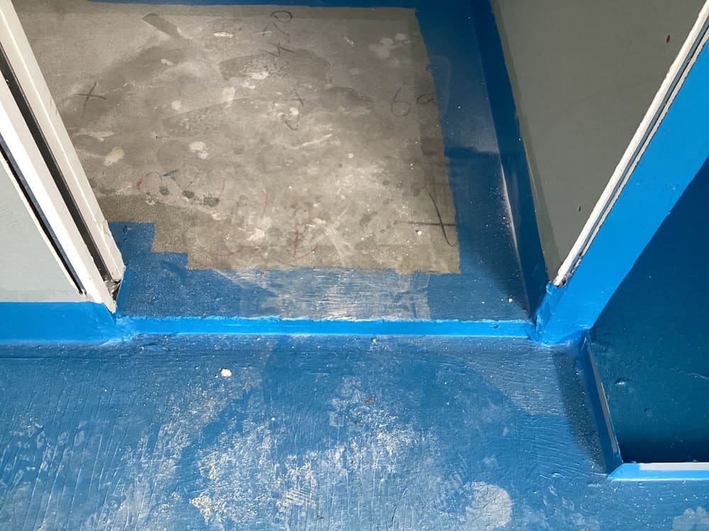 Waterstop angle required under doors, recorded during a waterproofing inspection in Benowa